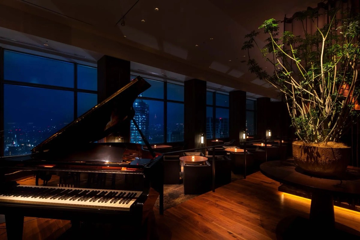 Grand piano and floor-to-ceiling windows at Bellovisto