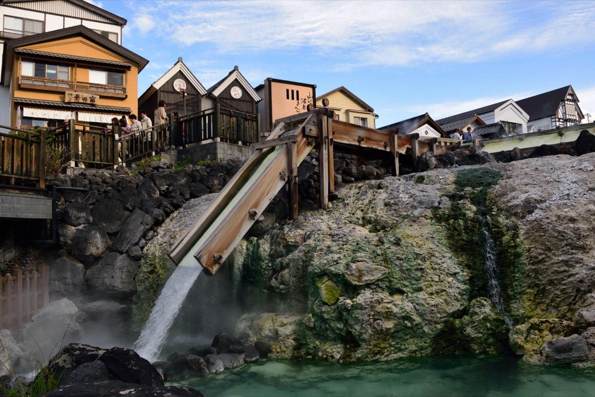 Steaming hot spring water flowing through the Yubatake in Kusatsu